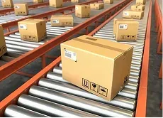 Cardboard parcels moving along warehouse conveyor belts